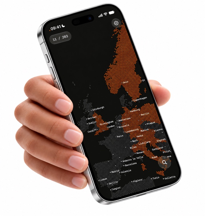 a hand holding an iPhone showing the dotted map in dark mode.
